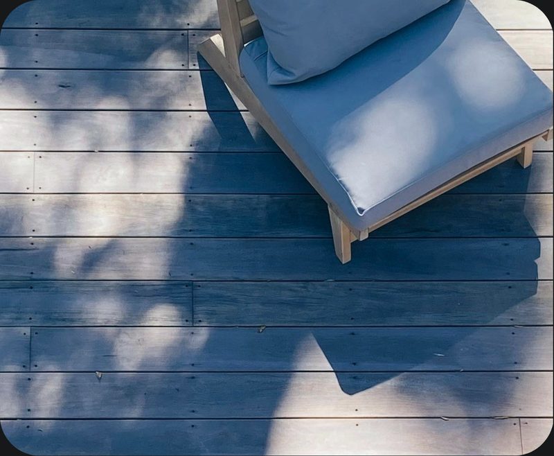 A shaded patio seating area in a managed community